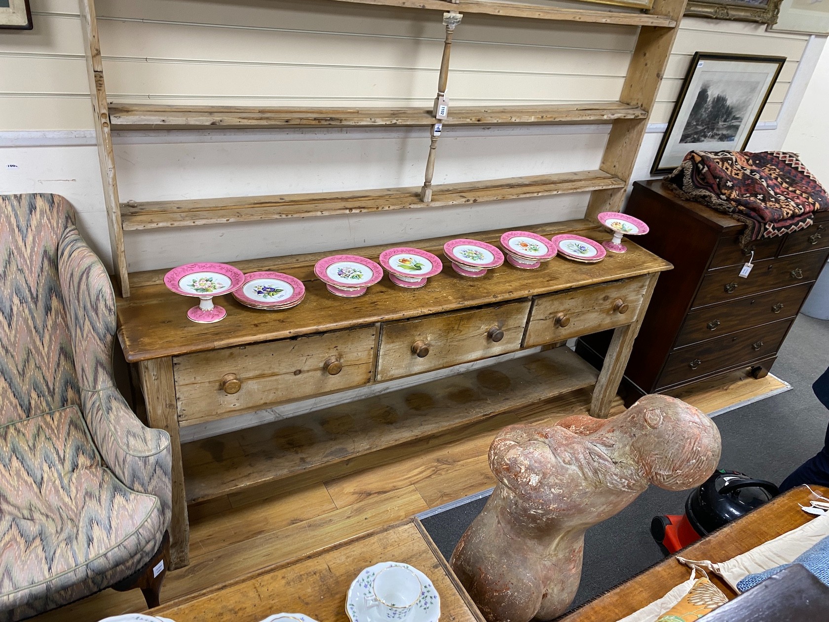 A large 19th century pale pine kitchen three drawer dresser, with open rack, length 214cm, depth 51cm, height 228cm